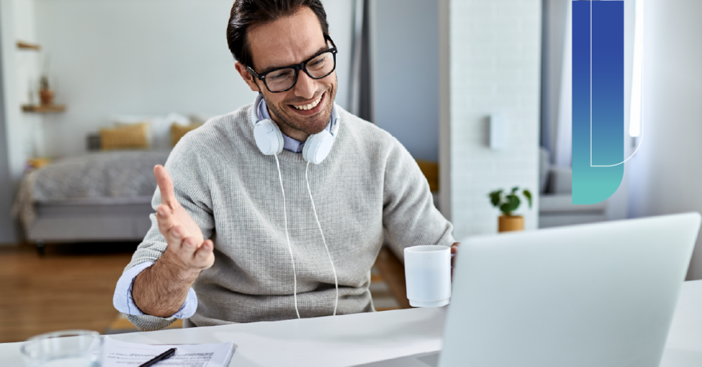 Remote professional engaging in a virtual meeting from a home workspace.