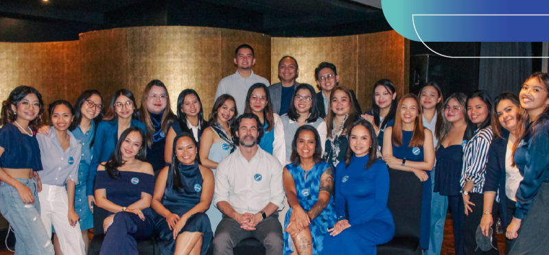 More Staffing team members gathered for a group picture during an event