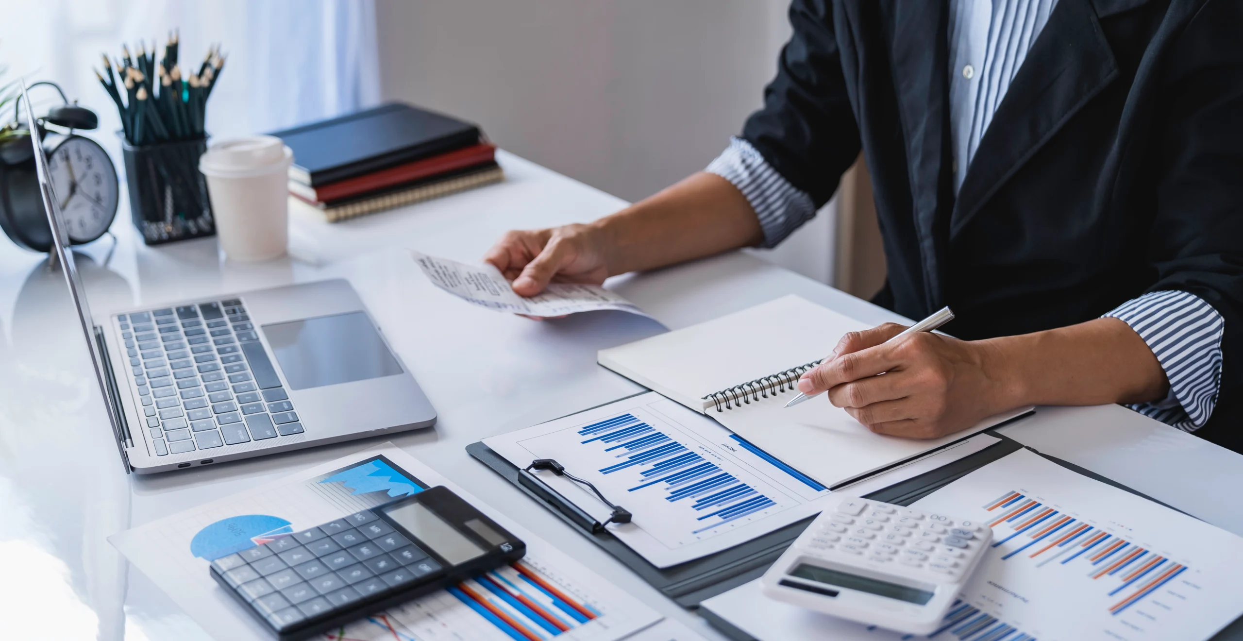 Accountant using a calculator for financial reporting