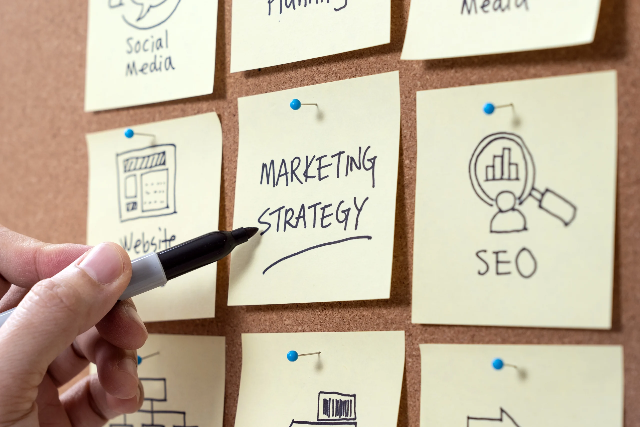 Marketing strategy planning board with sticky notes