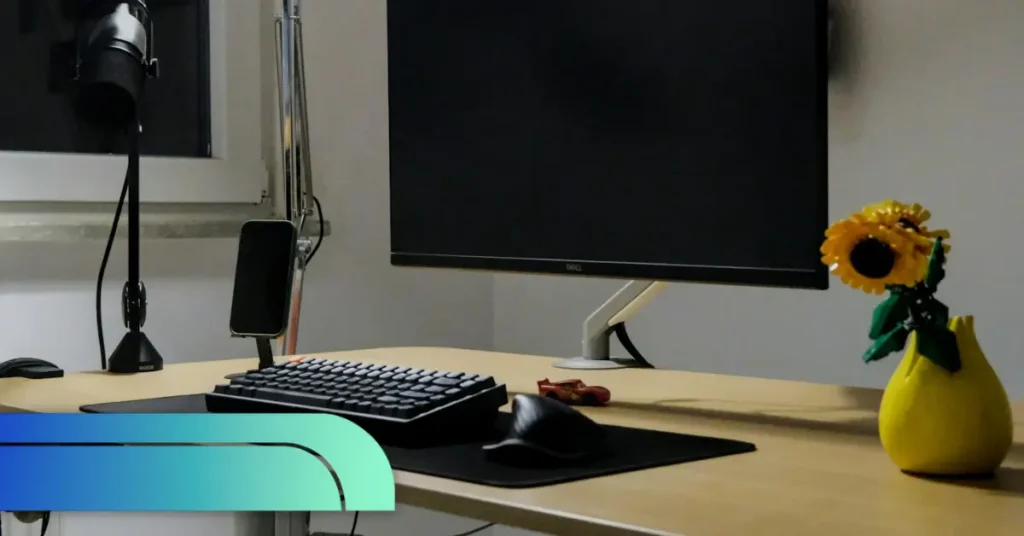 Home office setup with empty monitor and desk symbolizing remote work loneliness and remote employee wellbeing